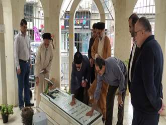 غبارروبی مزار شهید دانشکده علوم قرآنی آمل هم‌زمان با هفته دفاع مقدس